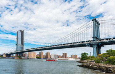 Manhattan Bridge with cloudy sky. New York City, USA.