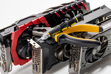 desktop hardware repair concept. tools for repair and variation of modern gpu or graphics cards on a background. hardware support conceptual