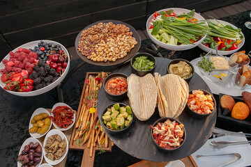 A lot of snacks with berries nuts grissini 