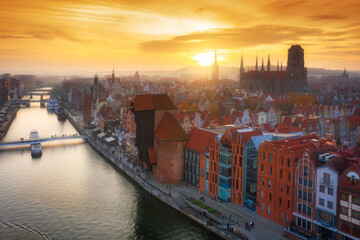Fototapeta premium Amazing cityscape of Gdansk over Motlawa river at sunset, Poland
