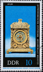 GERMANY, DDR - CIRCA 1975: a postage stamp from Germany, GDR showing an old astronomical clock from an Augsburg master (around 1560). antique clock