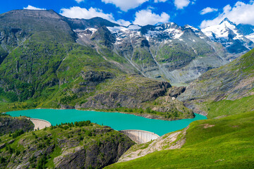 Naklejka na ściany i meble The beautiful view of mountain nature with lake in Glockner alps europe- taken from The Grossglockner High Alpine Road - Grossglockner Hochalpenstrasse