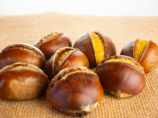 Heap of chestnut. Cooked and roasted edible chestnuts. Rustic autumn food. Still life food.