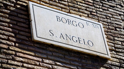 Marble street plate on the wall of the Il Passetto di Borgo, elevated walkway about 800 m long...