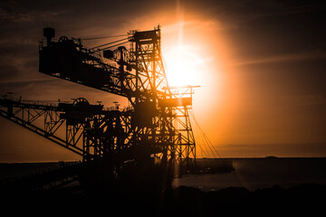 silhouette of coal mining excavator