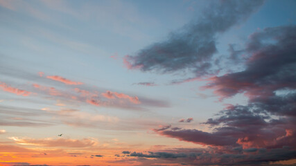 Dramatic big clouds in the vast sunset sky