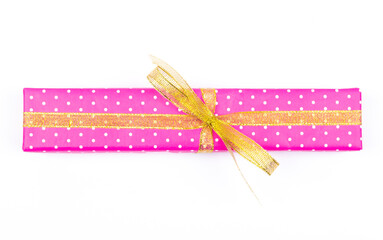 narrow bright gift box with gold ribbons on white background.top view