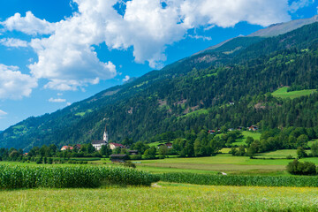 Mountain valley village landscape in Venediger alps . Mountain green valley village view austria near matrei in osttirol