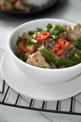  Soba noodles with chicken, hot pepper, zucchini, mushrooms, green onions on the  wooden background. Selective focus. Asian food