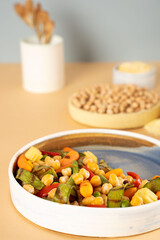 Homemade vegetarian stewed chick-pea chickpeas with vegetables. Style minimalism. Selective focus. On plate bowl close up. Concept healthy vegan diet protein organic food dish