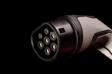 Charging plug for electric cars isolated on the black