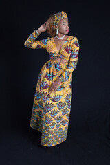 Obraz na płótnie Canvas Pensive woman in African Dress
