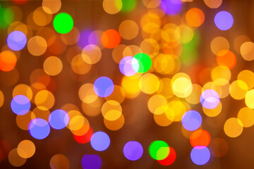 Golden lights holiday background. Abstract, bright multicolored background, blurry bokeh