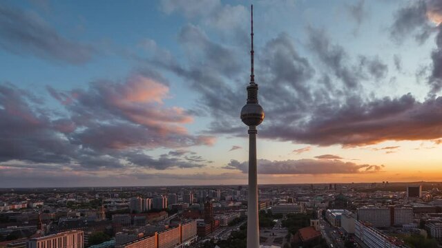 Berlin, Germany, time lapse view of Berlin cityscape including architectural landmark Fernsehturm TV Tower at sunset.