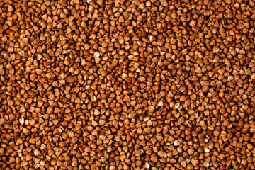 Background of buckwheat groats. Top view.