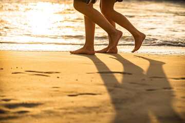 walking on a beach in sunset