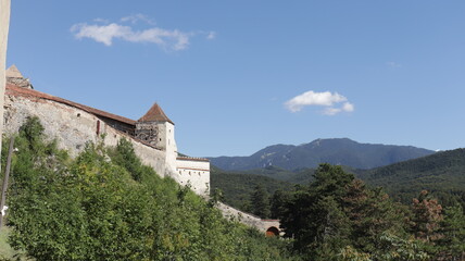 Fototapeta na wymiar rasnov castle with brasov mountains in the background