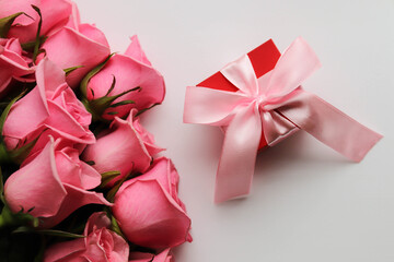 gift box with pink ribbon and rose
