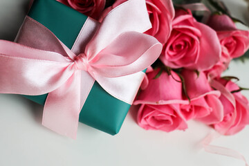 gift box with pink ribbon and rose