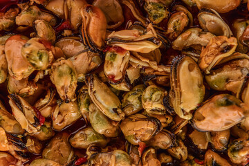 frozen mussels, in oil and marinade. Textures from delicious seafood