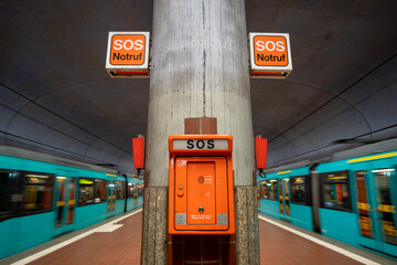 Emergency SOS telephone in a subway station in Frankfurt am Main, Germany