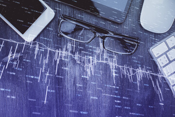 Multi exposure of forex graph hologram over desktop with phone. Top view. Mobile trade platform concept.