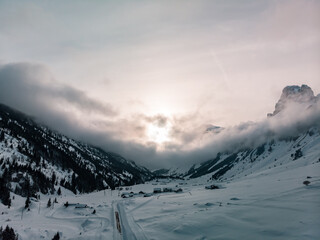 Klausenpass, Canton Uri, Switzerland: Aerial image of a beautiful sunset during winter with interesting could formations.