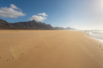 Fototapeta na wymiar Footprints in sand on Cofete beach, Fuerteventura island