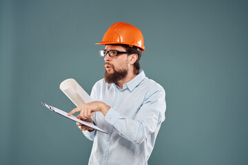 man worker with documents in hands wearing glasses orange helmet safety professional