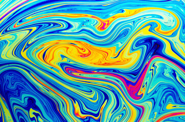Psychedelic abstract formed by light refraction on the surface of a soap bubble