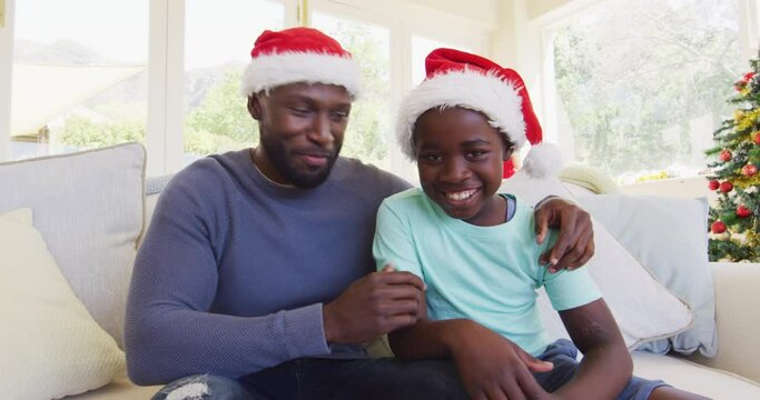 African american father and son looking at the camera
