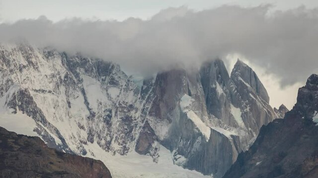 Cerro Torre with clouds rolling over the peak, Strong wind in Autumn, After Sunrise Light