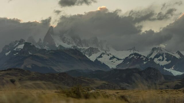 Cloudy Day at El Chalten with Mountains Fitz Roy, Clouds rolling Over Peak, Windy Weather in Patagonia
