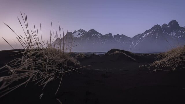 Iceland Stokksness Mountain with fog on the Ground, black sand, unique view at sunset