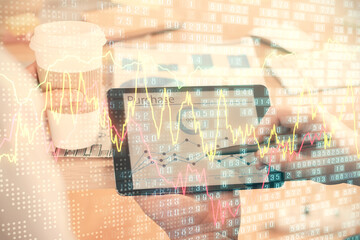 Double exposure of man's hands holding and using a phone and financial chart drawing. Market analysis concept.