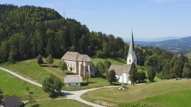 Fly over drone shot of a white monastery at Lese, Slovenia