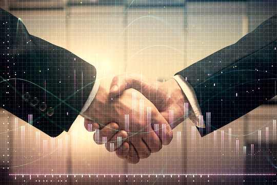 Double exposure of forex graph hologram and handshake of two men. Stock market concept.