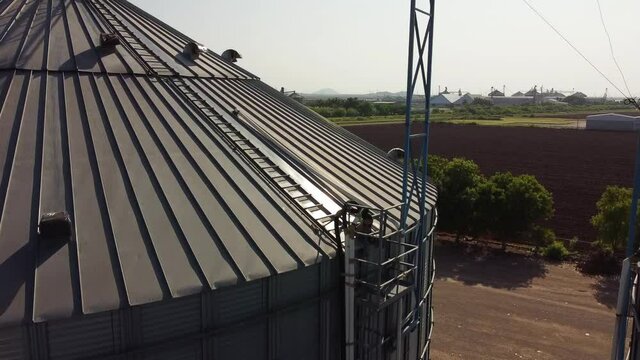 Agricultural Silo At Feed Mill Factory. Big Tank For Store Grain In Feed Manufacturing.