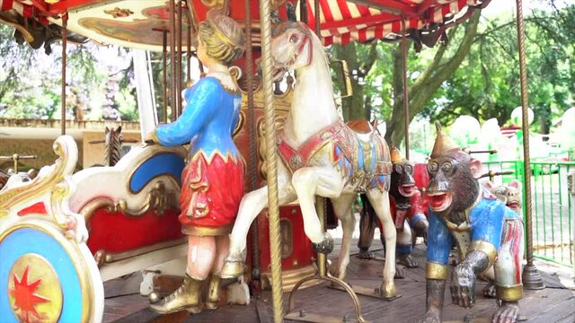 Wide shot of a carousel in an amusement park