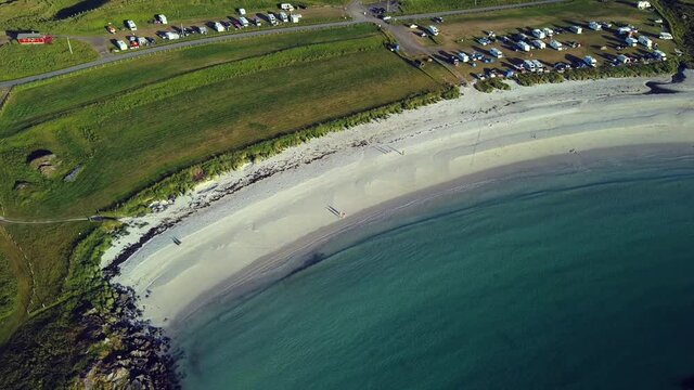 numerous camper vans parked near Hov beach, Hov Camping, Lofoten, sunny day