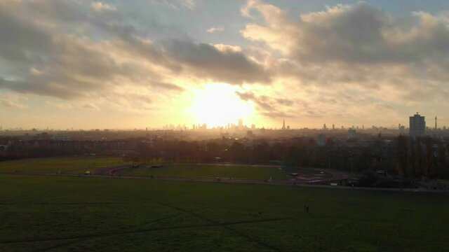 dolly forward drone hyperlapse shot of beautiful sunrise over London skyline