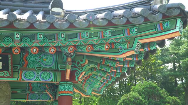 Dancheong - Korean Painted Roof Of Pavilion In Tomb Of Seven Hundred Patriots In South Korea. - panning left