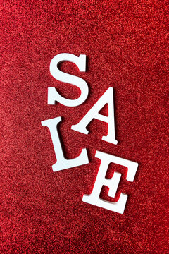 White Letters SALE On Red Glitter Background. Black Friday, Cyber Monday And Seasonal Sales Banner 