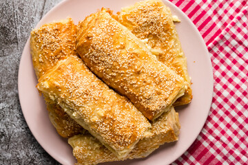 Traditional serbian cheese pie on plate - top view on Gibanica national homemade meal prepared in balkan - traditional cuisine healthy eating concept copy space