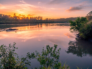 Beautiful Riverside Sunrise with Cloud Reflections