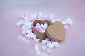 Pink marshmallow in gift box in form of heart on textile background, Many hearts marshmallows for present, Sweets in the form of hearts of marshmallow. Valentine's Day Gift