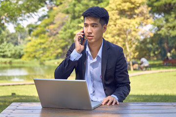 Asian business men working in the garden