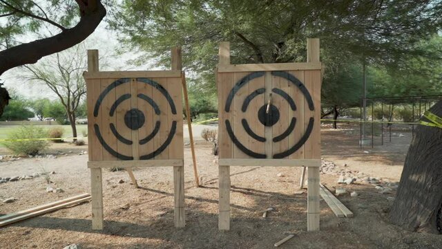 Axe Throwing at Target at Native Tribal Practice Event for Competition in Slow motion