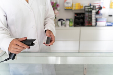 hands of a pharmacist girl checking a medicine