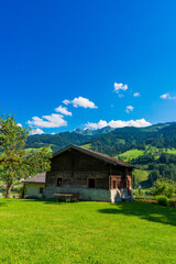 Mountain house garden landscape. Mountain cabin garden. House in mountains. Mountain home scene